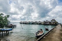 A rural traditional fisherman houses by the sea shore in Bintan Island A rural traditional fisherman houses by the sea shore in Bintan Island